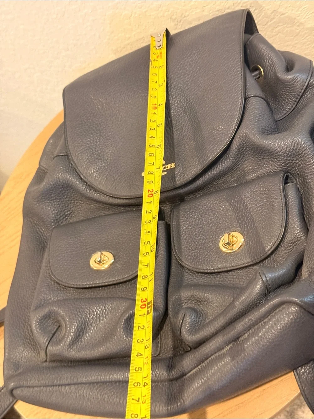 COACH Black Pebbled Leather Drawstring Backpack with Front Pockets